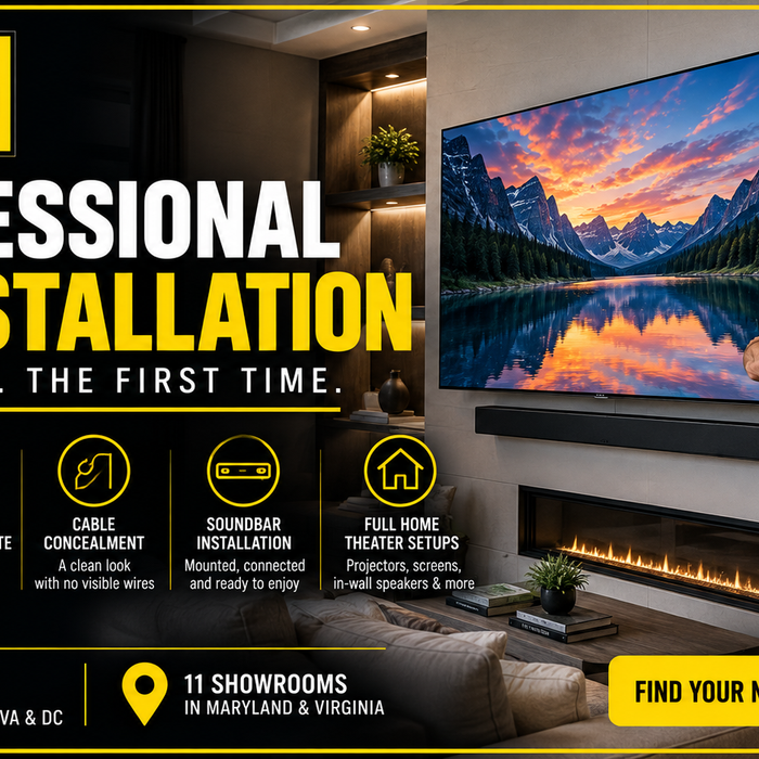 Professional Installers hanging TV and soundbar on wall over fireplace